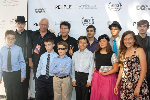 Joey Travolta surrounded by children from his film camp. Photo S. Valle